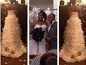 Idiot Black Female Straps A 1 Month Old Infant To The Back Of Her Wedding Dress As A Fashion Statement! (Video)