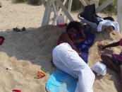 Man Records Black Life Guard Sleeping On Duty With Her Two Bastard Kids In Tow! (Video)