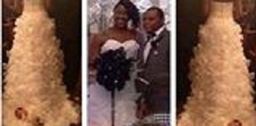 Idiot Black Female Straps A 1 Month Old Infant To The Back Of Her Wedding Dress As A Fashion Statement! (Video)