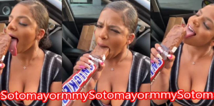 Look At What This Woman Decided To Do To This King Size Snickers Bar With Her Mouth! (Video)